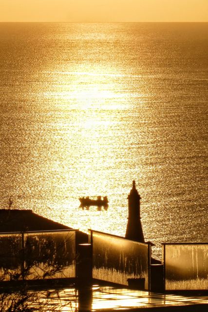 Fishing boat at sunrise, Luz (51881716321).jpg